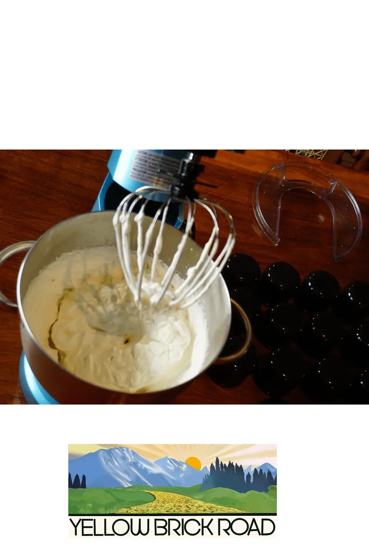 Whipped shea body butter in mixer with Yellow Brick Road branding.