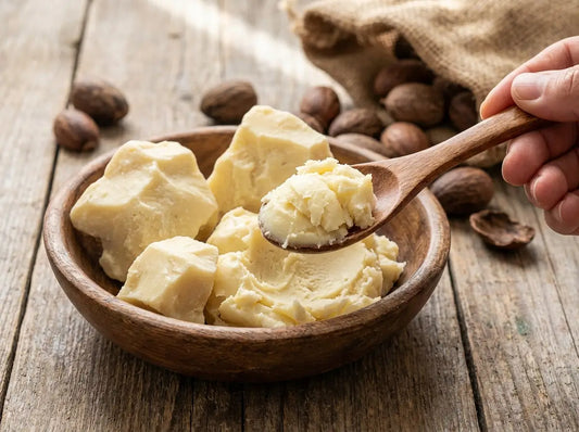 Open jar of raw Shea Butter showing natural texture.